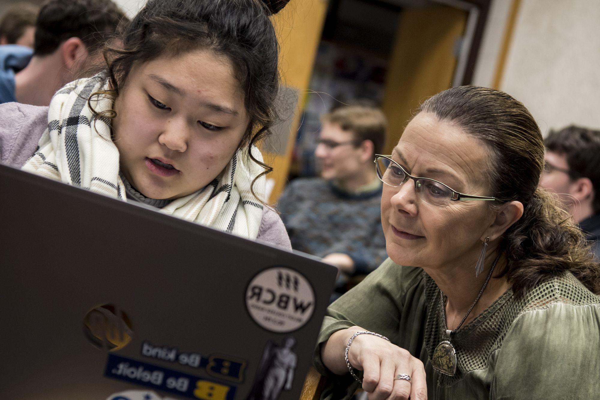 Professor of Anthropology Shannon Fie works with students individually in the Logan Museum lab.